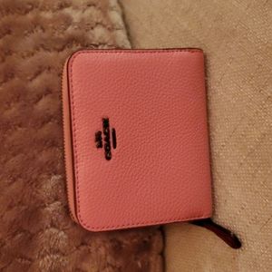 Coach leather wallet with snap closure in rose pink